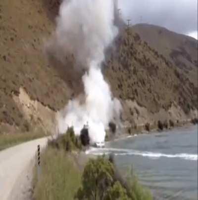 Guy extinguishing a boat with his own boat