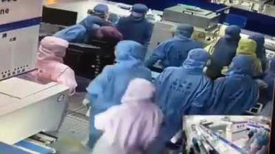 Chinese Workers Stand Still Like Robots While Fellow Co-Worker Tries To Kill Another Assassin’s Creed Style!