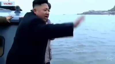 North Koreans running into the water to reach Kim Jong Un's boat