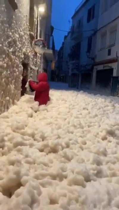 Sea foam flooding the streets after a storm in Spain