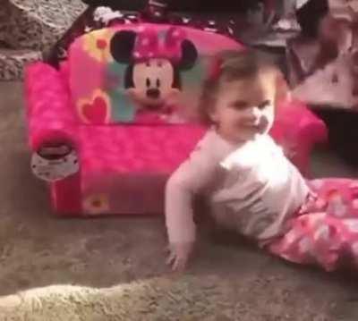 This little girl is so excited about her Minnie chair