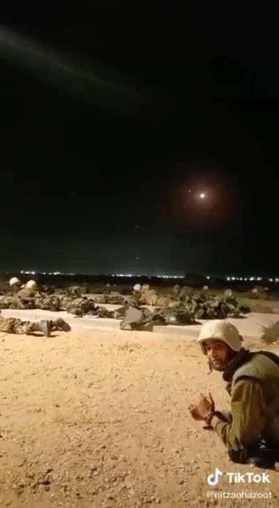 Israeli Soldiers in a open field while the iron dome does its thing overhead