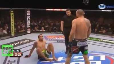 Fabricio Werdum does a kipup before slamming a leg kick to the body on Travis Browne