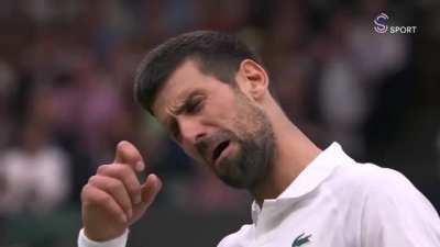 Novak shows the Wimbledon crowd how he's feeling about their boos.