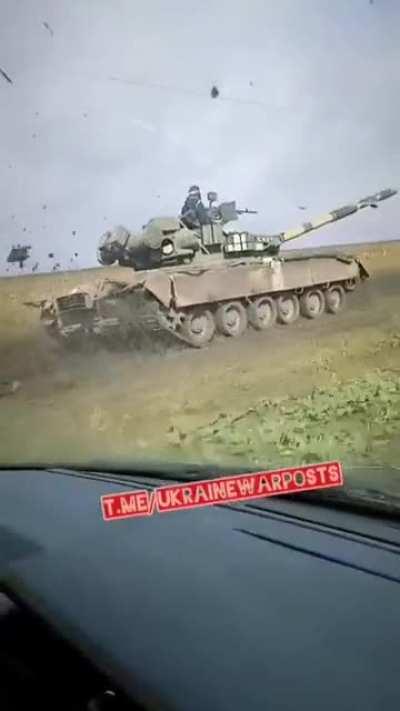 Ukrainian soldiers racing their comrades in a Tank