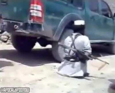 Small Taliban fighter with an AK