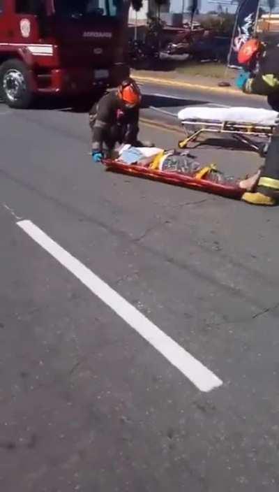 Firefighters drop injured man on a stretcher