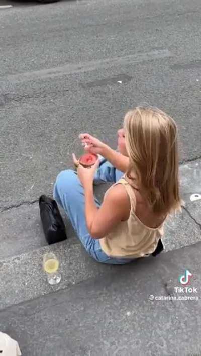 Influencer at a wine bar in Paris that precisely states NO TIKTOKS on their storefront