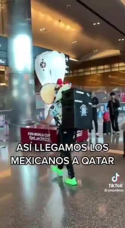 Man walks through Qatar airport with loud speaker on his back, recording himself in the process.