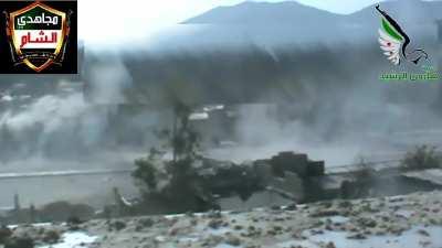 Opposition fighter takes a crack at an SAA BMP moving through Jobar, Damascus - 4/7/2013