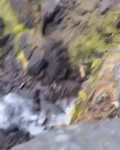 Boulder rolls off a cliff and is pulverized upon landing 