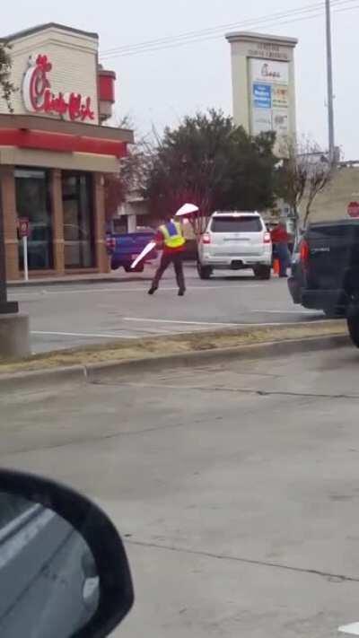 Parking lot attendat with real lightsabers...