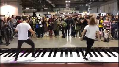 Dancers play pirates of the Caribbean Theme song on a feet Piano ( idk if this was posted before )