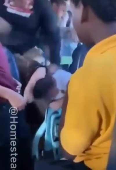 A student has been arrested after video showed two others beating a girl on a school bus in Florida