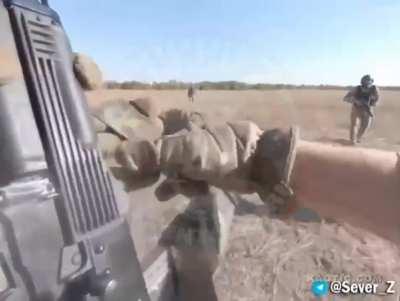 2 English speaking fighter's come out of position to greet 2 Soldiers running towards them. One of the English speaking fighter's says 