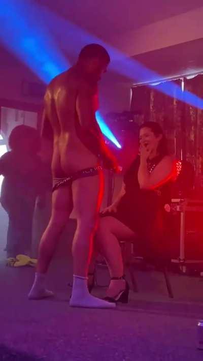 Shy housewife onstage with male stripper