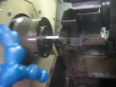 CNC-Lathe machine programmed to sharpen worker's pencil (when boss is away).