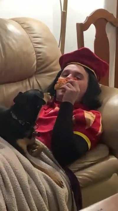 Just a Lord with some pizza and a dog