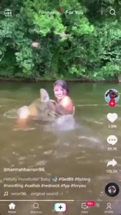 This father and daughter noodling and came away with this catfish