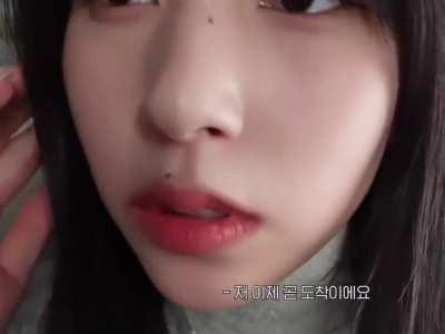 Mina holding the camera close to her face