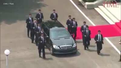 Kim Jong Un's bodyguard protecting his limo