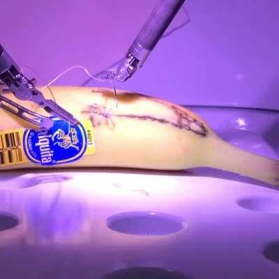 Surgeon in London performing remote surgery on a banana located in California via 5G.