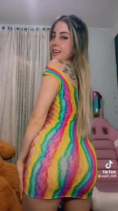 wearing colorful fishnet dress