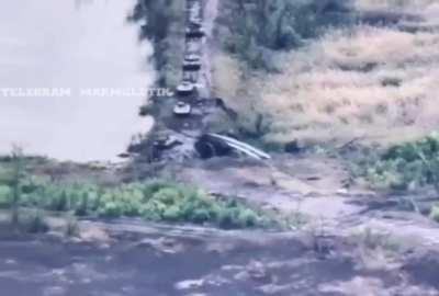 A Russian BMP falls of a pontoon bridge while trying to cross as part of a Russian assault somewhere near Vodyane, southwest of Avdiivka