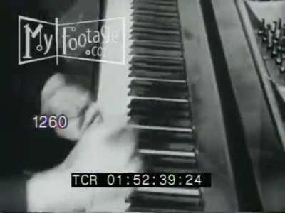 Footage of Henry Cowell playing a piano (1923)