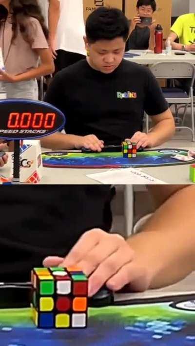 Max Park solving a 3×3 Rubik's cube single-handed in a World Record 6.2s. He's so much in the momentum that he immediately picks up another cube on the table after he's done with the target.