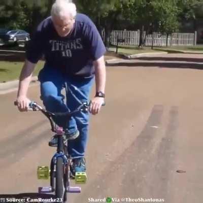 BMX Dad casually pulling off insane trick.