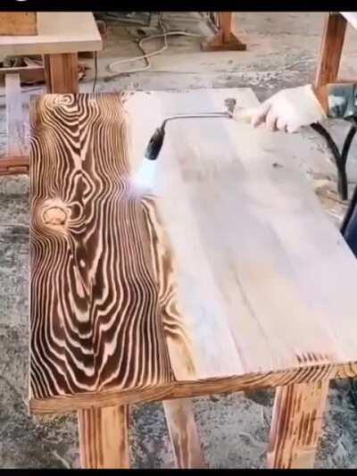 Applying a burnt wood finish to a tabletop