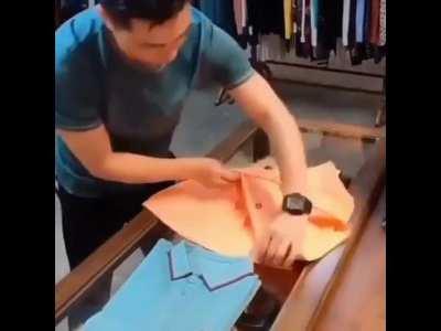 This guy folding t-shirts.