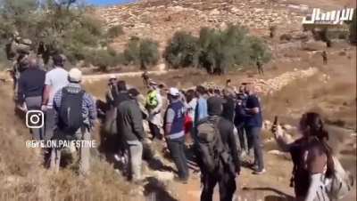 Israeli soldiers and Jewish settlers attack Palestinian farmers and foreign activists who were picking olives in village of Burqa, east of Ramallah in occupied West Bank
