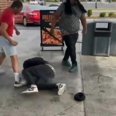 Teens fighting at a gas station