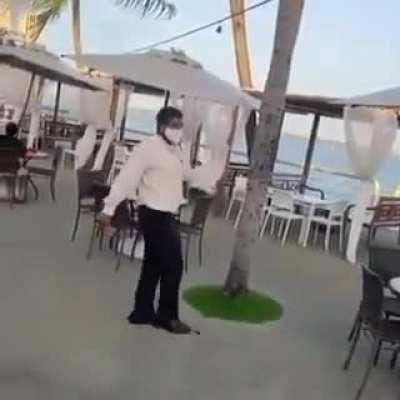 Waiter takes some time off to dance and enjoy life while working