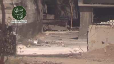 Syrian Army soldier wanders into the sights of an Opposition MG before darting back into cover - Jobar, Damascus - 2013