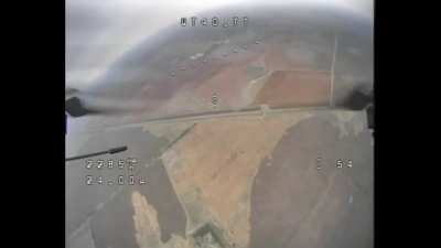 Training footage of a Russian FPV drone approaching a Russian recon drone, the latter has a second camera in the back which detects the FPV drone and causes the recon drone to perform an evasive maneuver