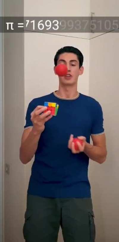 That guy solving the Rubik's cube, juggling and saying the Pi Greek simultaneously