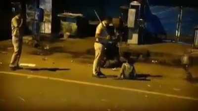 Delhi police beating an innocent child in the darkeness of night.