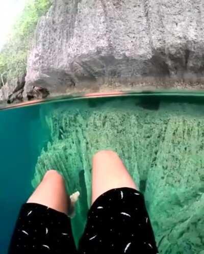 Barracuda Lake on Coron Island in the Philippines is thermocline, layers of hot and cold water, is surrounded by limestone cliffs, it has both salt and freshwater, and is incredible clear