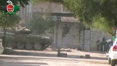 Syrian T-72 pops in to an active fire fight and is engaged immediately by an opposition anti-tank team - Douma, Syria - October 2012