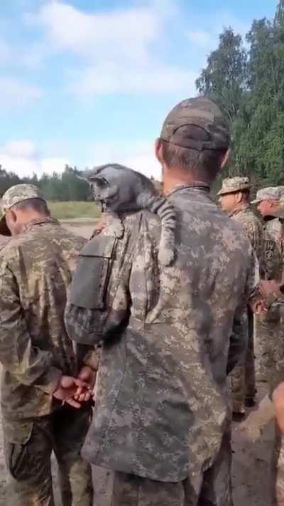 Defenders of Ukraine and their furry comrade