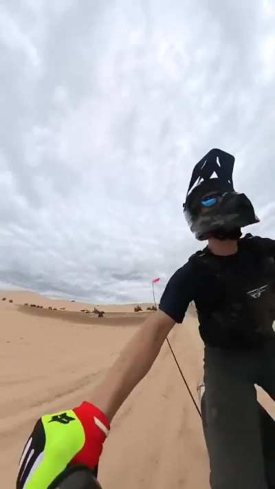 Dirt biker crashes head on into a jeep jumping over a hill