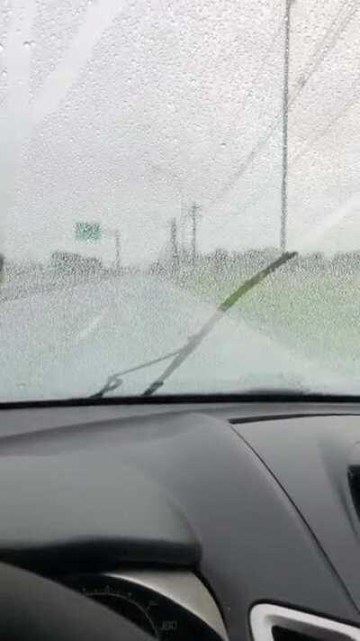 Windshield with hydrophobic coating. Once you get enough speed, you don’t even need the wiper.