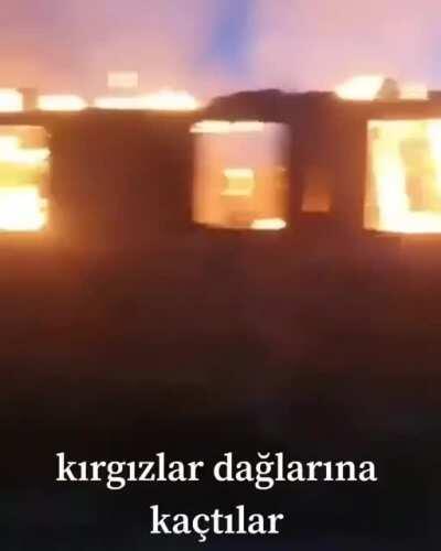 Tajiks burning the homes of Kyrgyz civilians