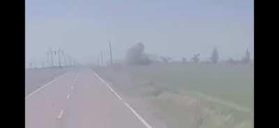 Russian turtle tank under fire by artillery or drones.