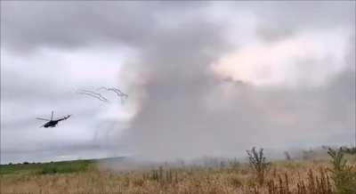 Two Ukrainian Mi-8 attack helicopters doing a extremely low pitch-up rocket attack on Russian positions on the front line. (June 30, 2023/music added by source) 