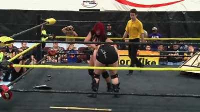 Mickie Knuckles kicked between the legs by Saraya