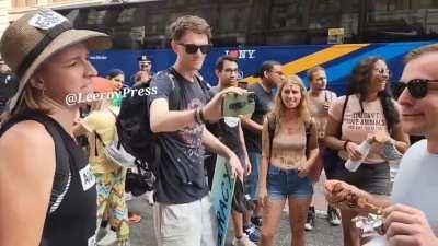 Man eats Kebab in front of animal rights activists.